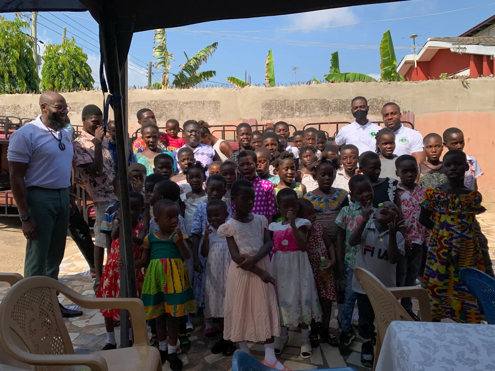 SAME Foundation volunteers engaging with children during orphanage support visit in Ghana