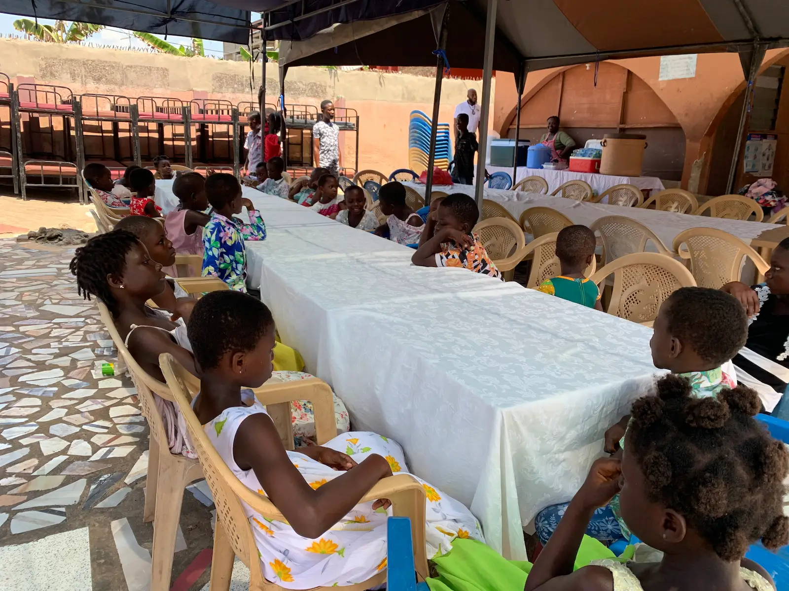 SAME Foundation volunteers mentoring young children during community outreach in Ghana